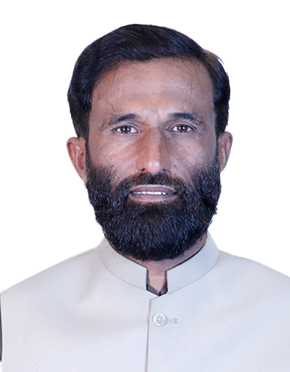 Head-and-shoulders portrait of a man with a full dark beard and short dark hair, wearing a light beige traditional kurta against a white background.