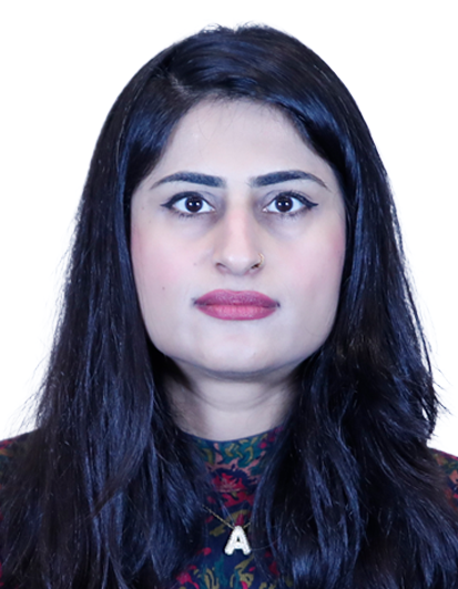 Front-facing portrait of a woman with long dark hair, nose ring, and a patterned top against a white background.
