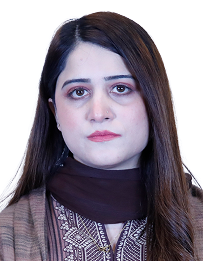 Portrait of a woman with long dark hair, wearing a brown patterned outfit and scarf, facing the camera with a neutral expression